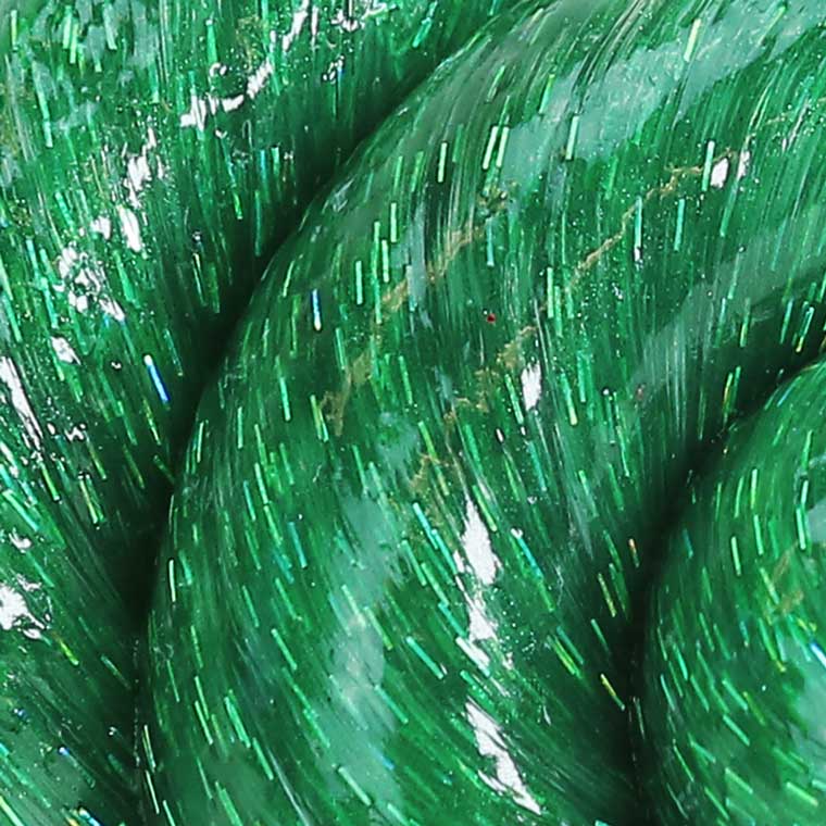 Close up texture of green glitter putty.