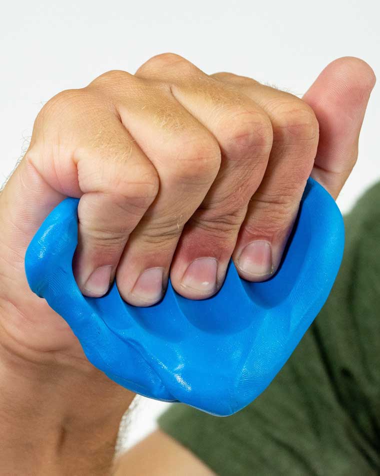 Hand squeezing blue color putty.