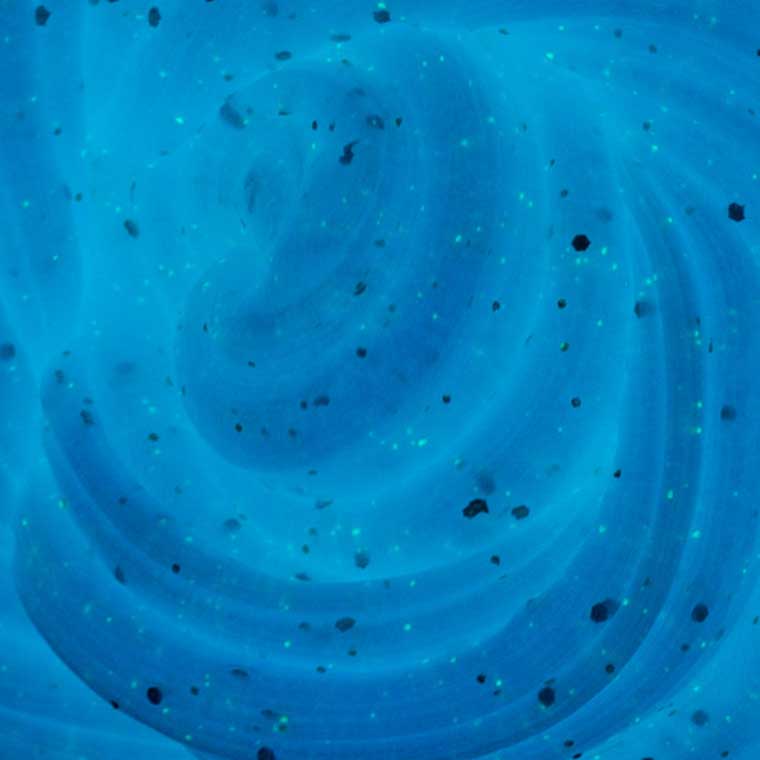 Close up detail of glowing blue putty.