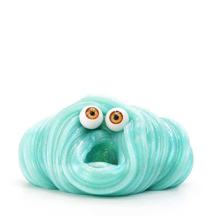 Brown eyeballs placed on a blob of teal putty.