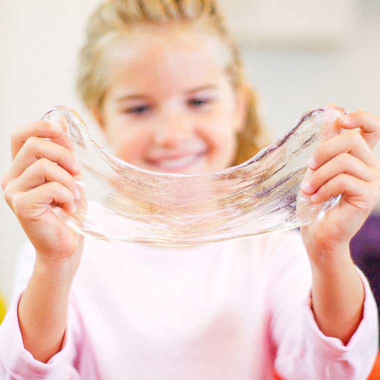 Girl playing with Crystal Clear Thinking Putty®.