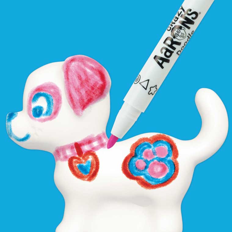 White putty in the shape of a puppy with pink marker drawn on it.