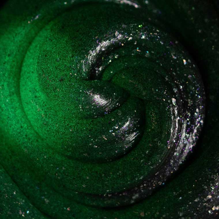 Close up texture of gray putty glowing green.