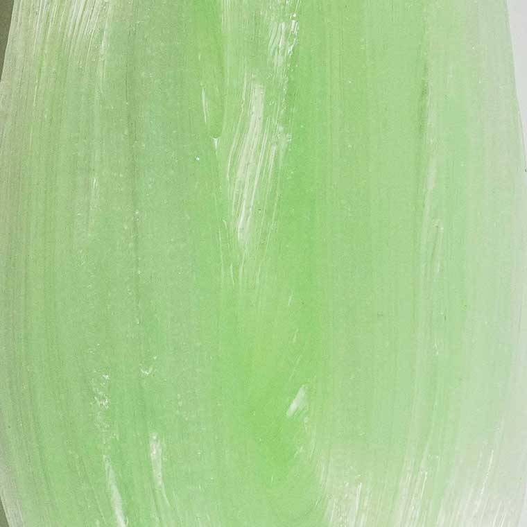 Close up texture of green non-glowing putty.