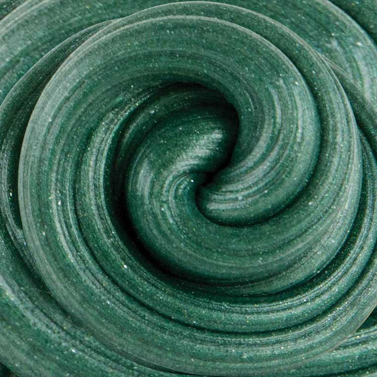 Close up texture of green sparkle, pine scented putty.
