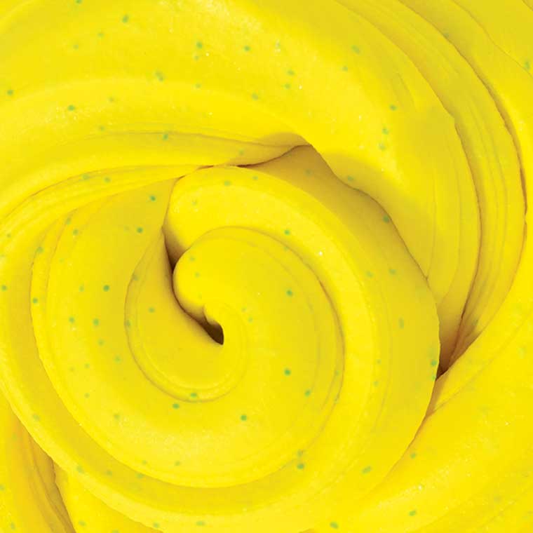 Close up texture of bright yellow, banana scented putty.