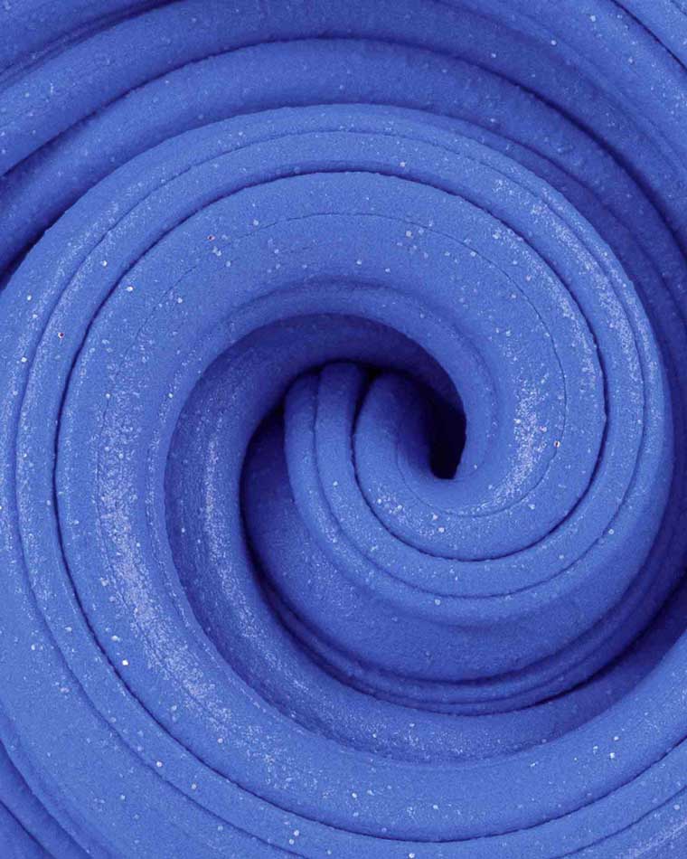 Close up of blue color, berry scented putty texture.