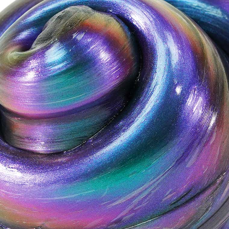 Close up smooth texture of holographic purple Thinking Putty®.