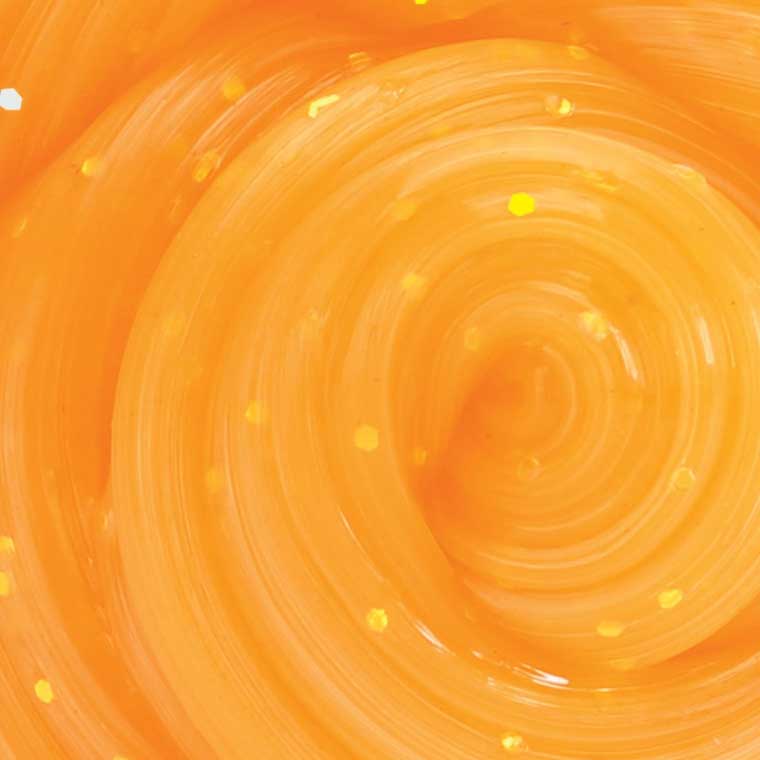 Close up texture of orange glitter putty.