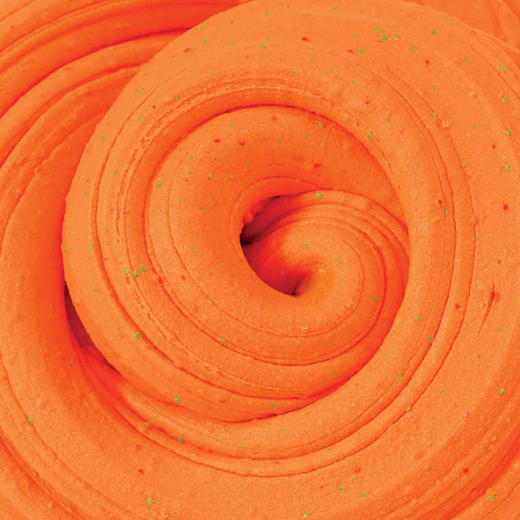 Close up texture of orange, tropical scented putty.