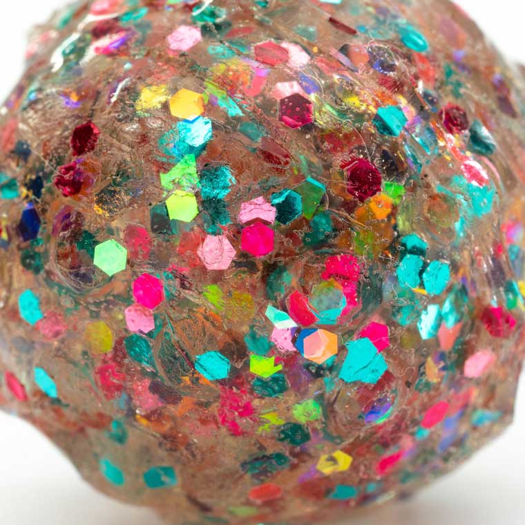 Close up of multi glitter molded X-Ball.